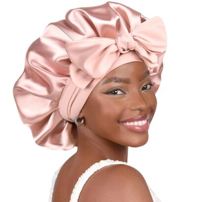 Woman wearing a pink satin bonnet.