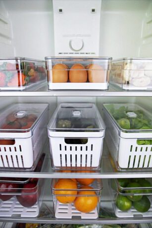 Simple fridge organization ideas with clear bins, neatly arranged food, fresh produce, and an organized refrigerator for a cleaner kitchen.