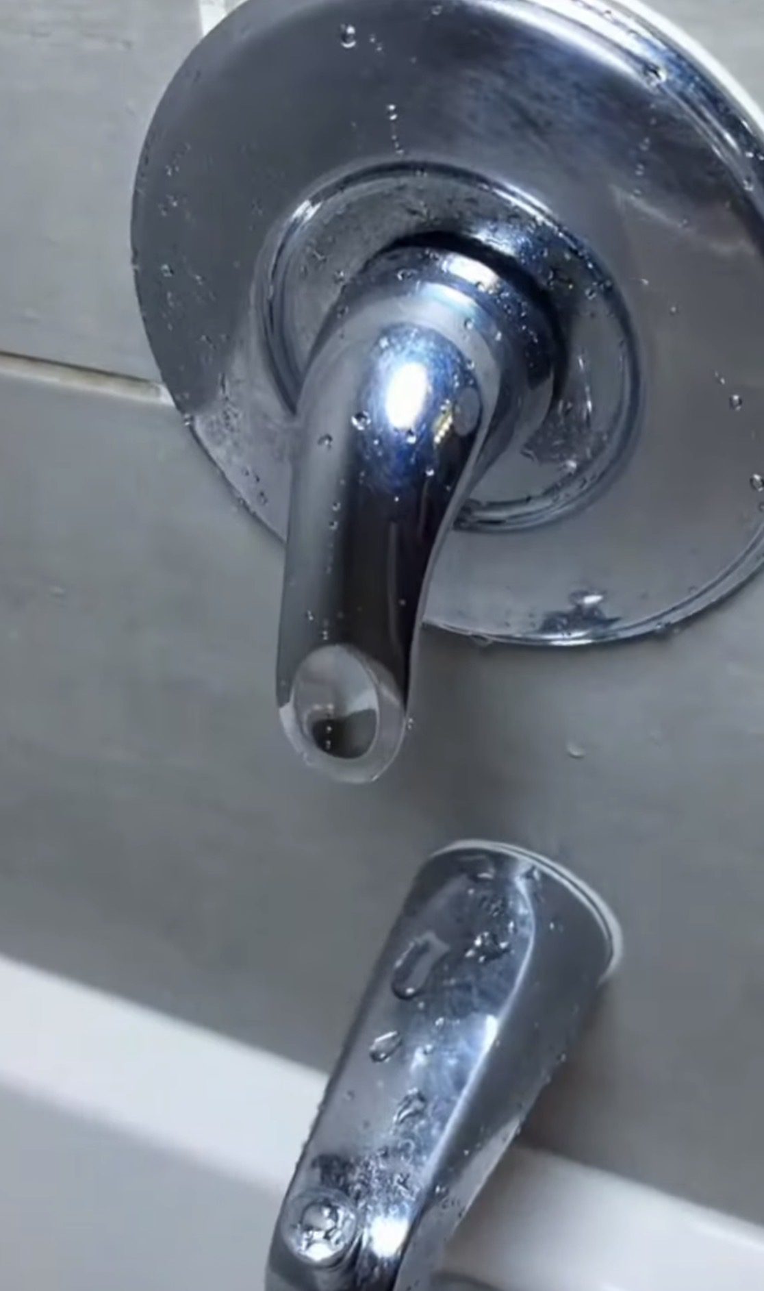 Clean shiny shower faucet and tub spout after cleaning