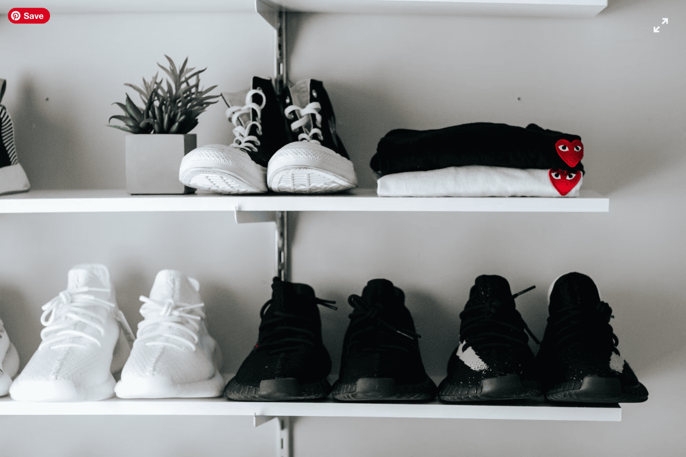 Neatly organized shoe shelves in a mudroom entryway