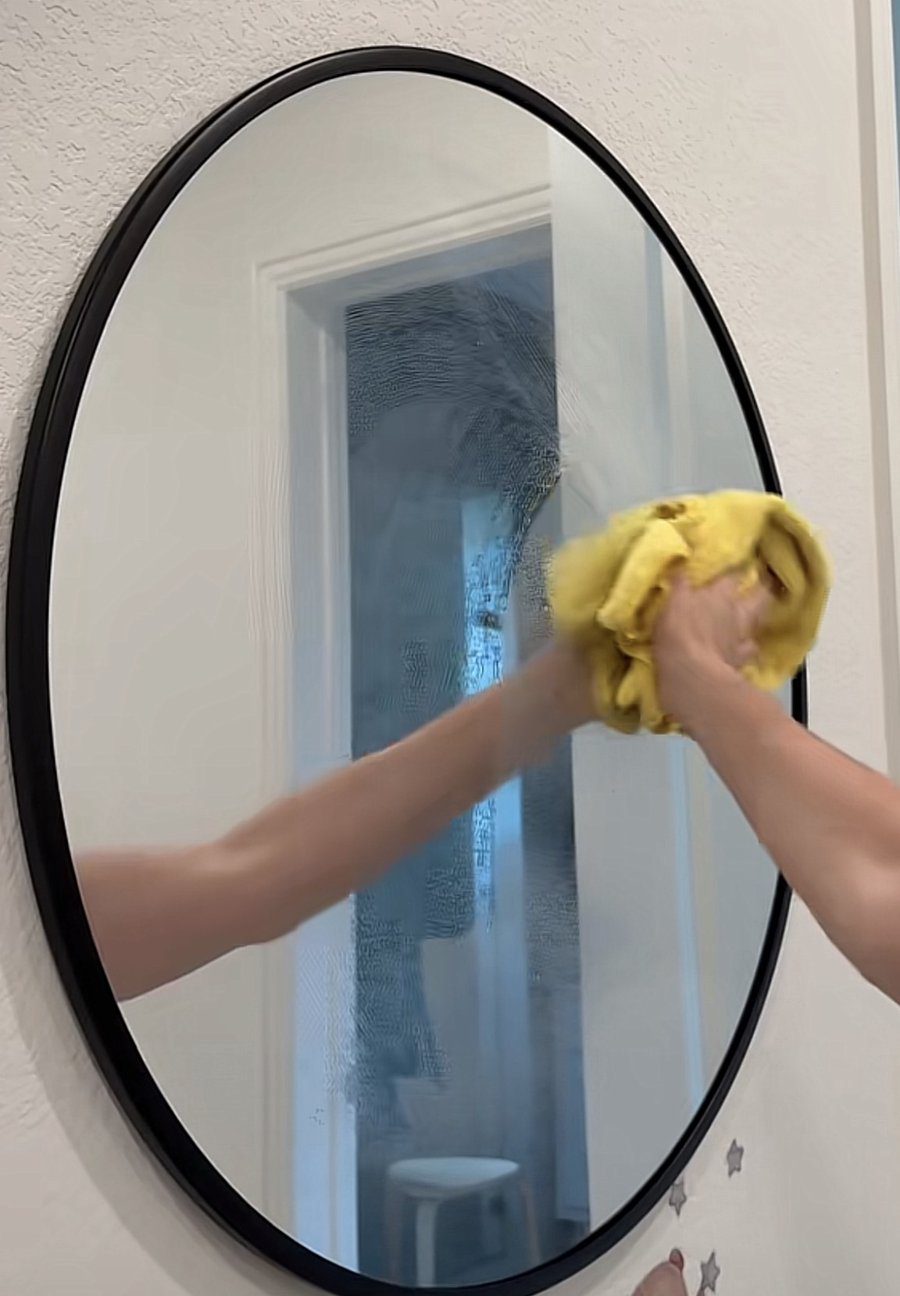 Mirror covered in water spots before using homemade window cleaner